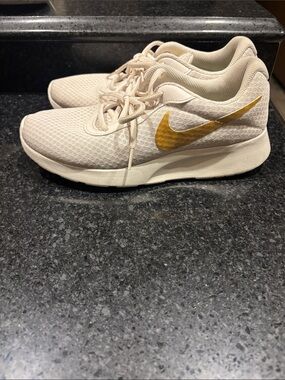 Nike Women's Cream/Tan Sneakers with Gold Swoosh